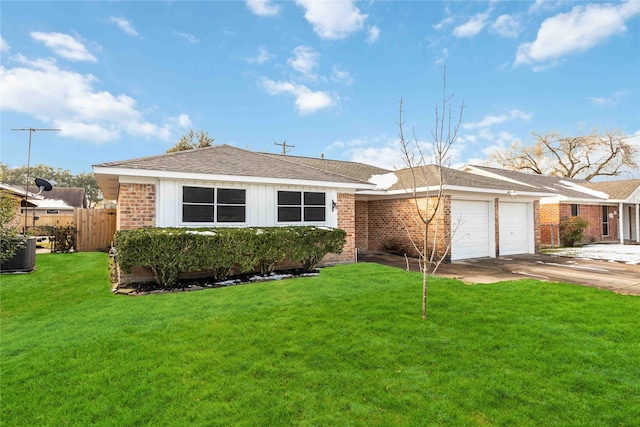 single story home with a garage, central AC unit, and a front yard