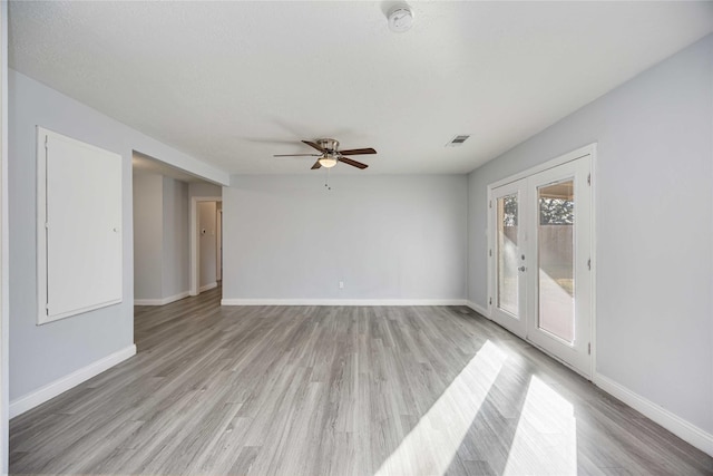 spare room featuring ceiling fan and light hardwood / wood-style floors