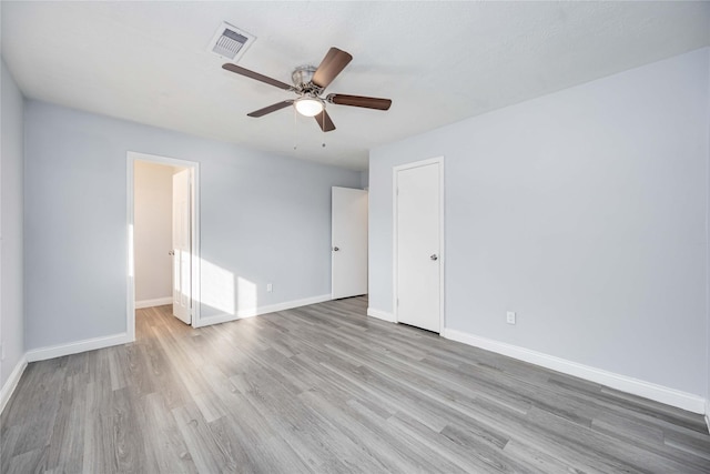 unfurnished bedroom with ceiling fan and light wood-type flooring