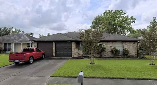 ranch-style home featuring a garage and a front yard