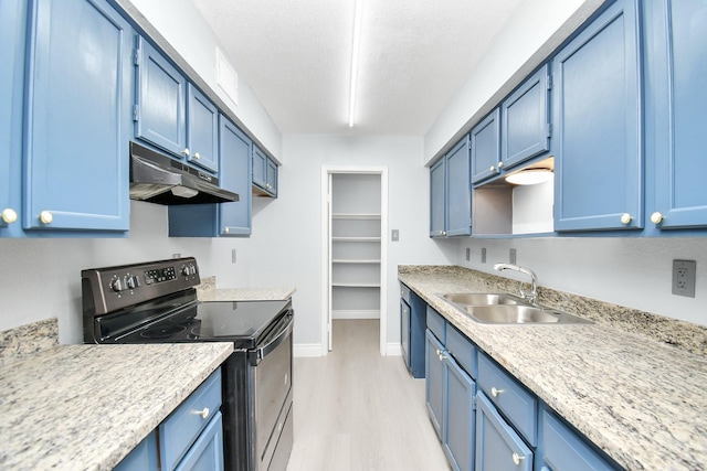 kitchen with sink, light hardwood / wood-style flooring, range with electric cooktop, and blue cabinetry