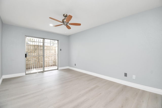 empty room featuring ceiling fan and light hardwood / wood-style flooring