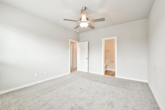 unfurnished bedroom with a walk in closet, carpet floors, ceiling fan, and a closet