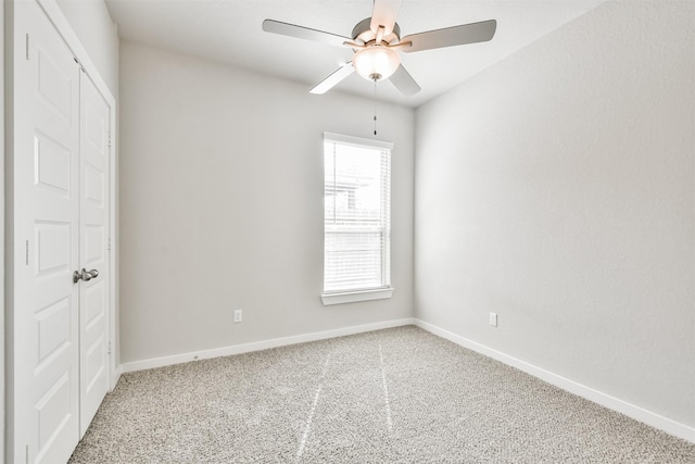 unfurnished room with carpet floors and ceiling fan