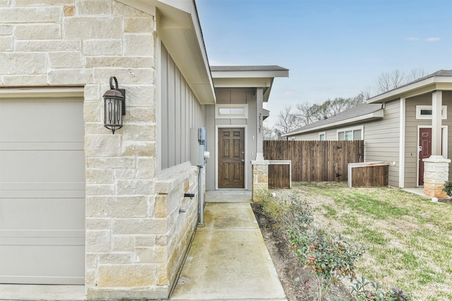 view of exterior entry featuring a garage