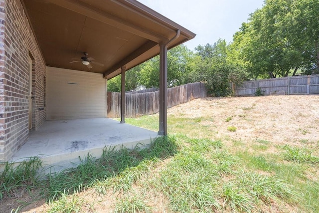 view of yard with a patio and ceiling fan