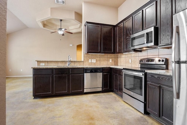 kitchen with sink, ceiling fan, stainless steel appliances, dark brown cabinetry, and light stone countertops