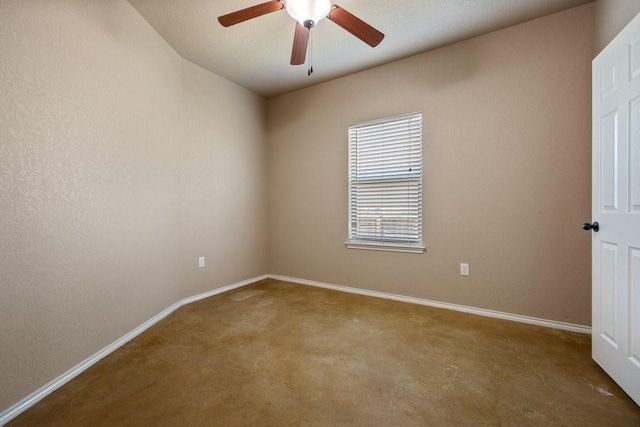 empty room featuring ceiling fan and carpet