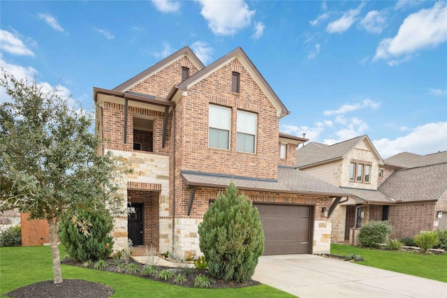 view of front of house featuring a garage and a front lawn