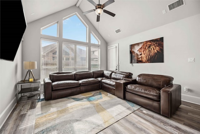 living room featuring high vaulted ceiling, hardwood / wood-style floors, and ceiling fan