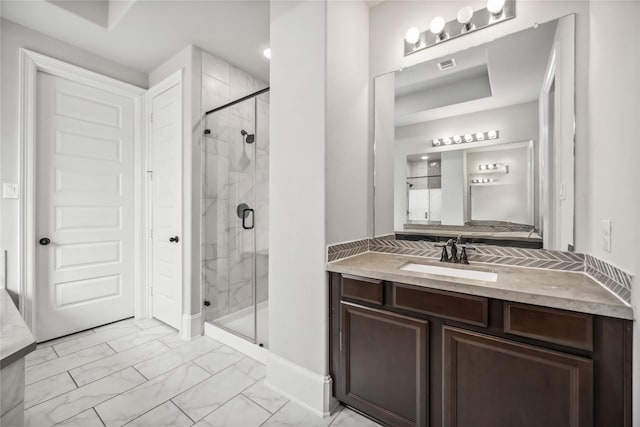 bathroom with vanity and walk in shower