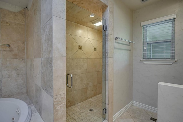 bathroom with tile patterned floors and shower with separate bathtub