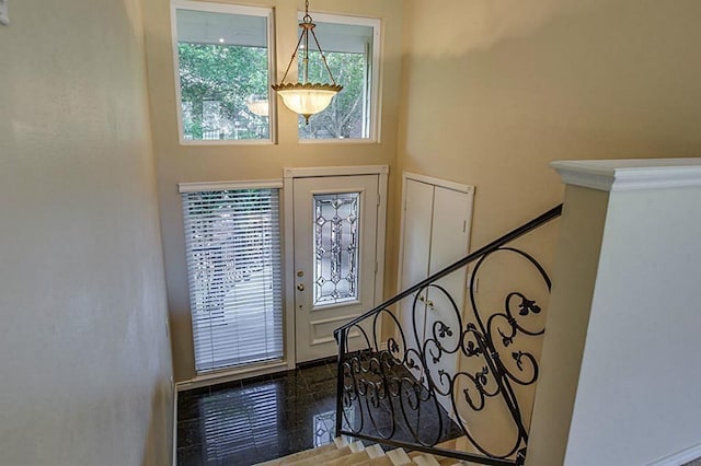 foyer entrance featuring a high ceiling