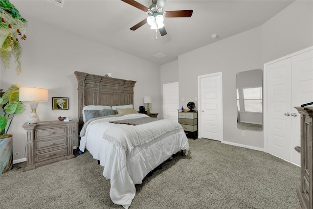 carpeted bedroom with vaulted ceiling and ceiling fan