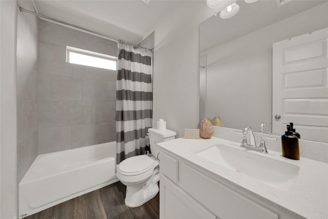 full bathroom with vanity, wood-type flooring, toilet, and shower / bath combo