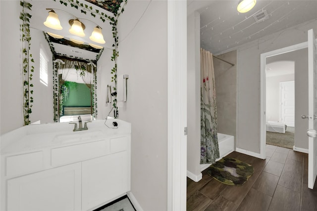 bathroom featuring vanity and shower / bath combo with shower curtain