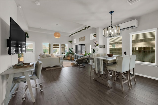 dining room with an inviting chandelier and a wall unit AC