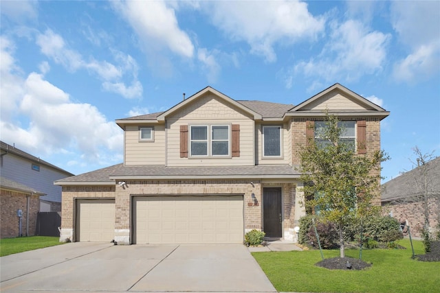 view of front of home with a garage and a front lawn