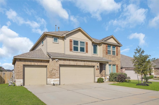 view of front of house with a garage and a front yard