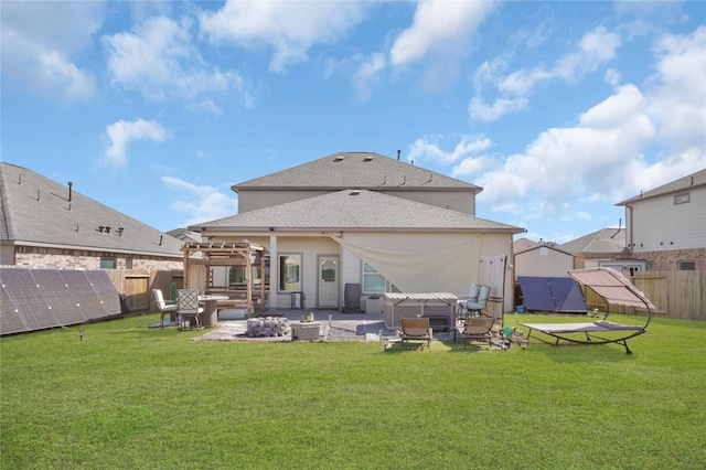 back of property with a patio, a pergola, an outdoor fire pit, and a lawn