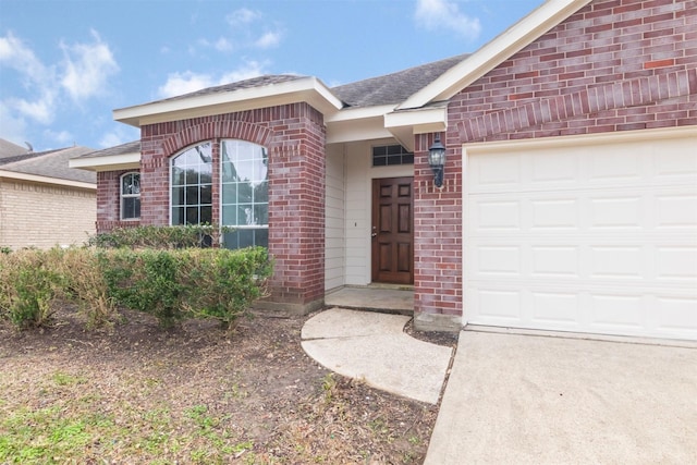 entrance to property featuring a garage