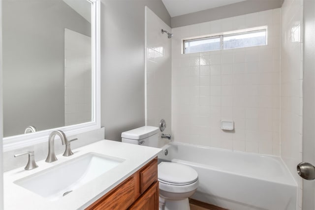 full bathroom with toilet, vanity, and  shower combination