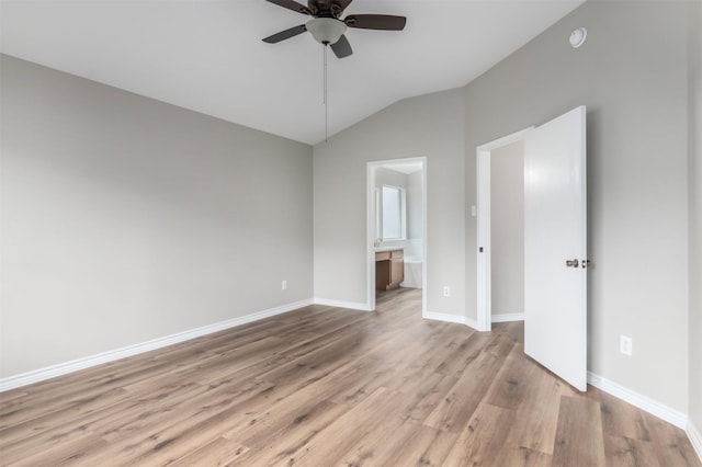 interior space featuring light hardwood / wood-style flooring, ceiling fan, and vaulted ceiling