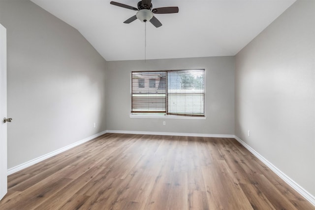 unfurnished room featuring vaulted ceiling, hardwood / wood-style floors, and ceiling fan