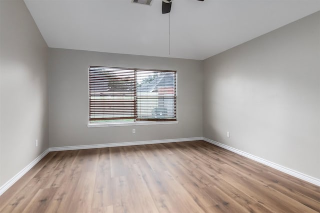 unfurnished room with ceiling fan and light hardwood / wood-style floors