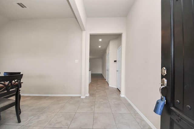 entryway with light tile patterned flooring