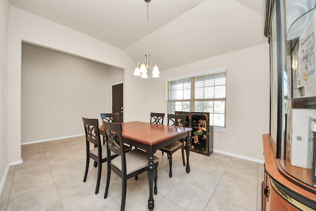 dining room featuring light tile patterned flooring, lofted ceiling, and an inviting chandelier