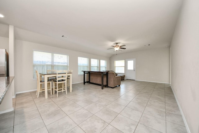 living room featuring light tile patterned flooring and ceiling fan