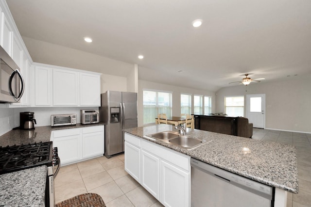 kitchen featuring white cabinetry, sink, an island with sink, and appliances with stainless steel finishes