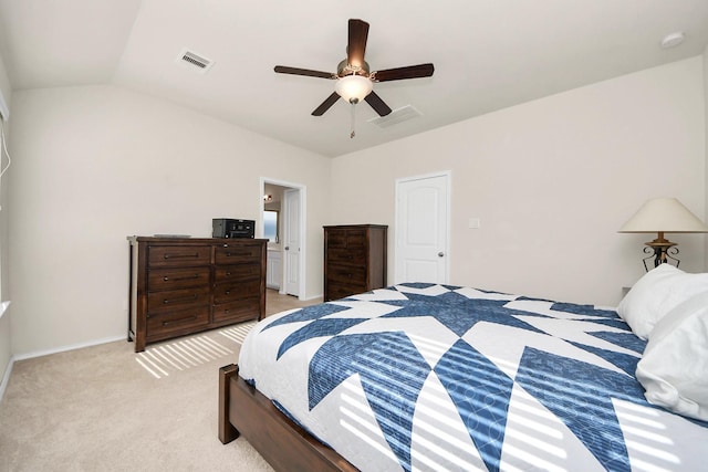 bedroom with light carpet, vaulted ceiling, and ceiling fan