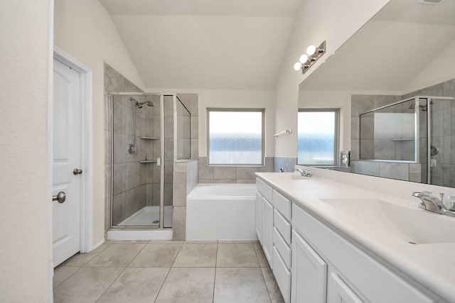 bathroom featuring lofted ceiling, vanity, tile patterned floors, and plus walk in shower