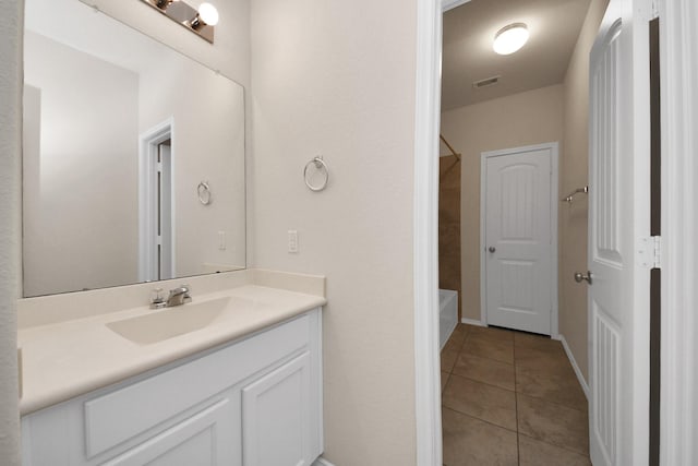 bathroom with tile patterned flooring and vanity