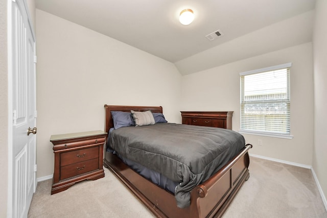 carpeted bedroom featuring vaulted ceiling