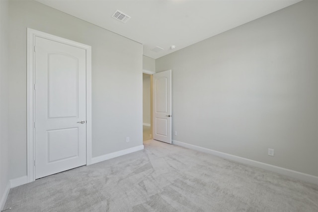 unfurnished bedroom with light colored carpet