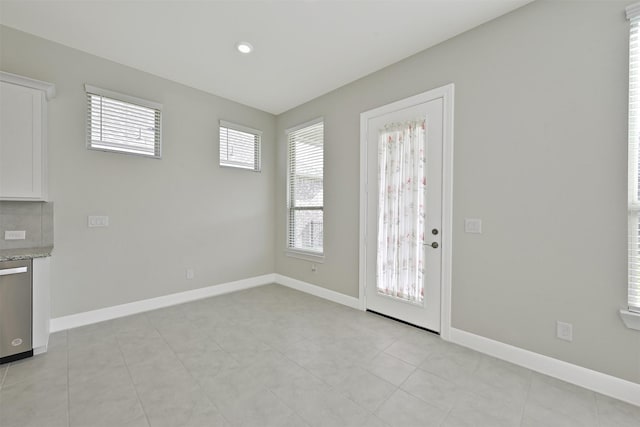 interior space featuring a healthy amount of sunlight and light tile patterned floors