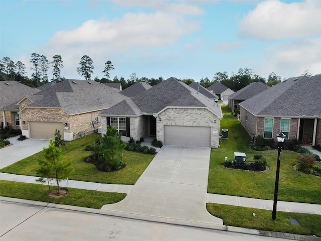 view of front of home with a garage and a front lawn