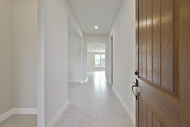 hall with light tile patterned flooring