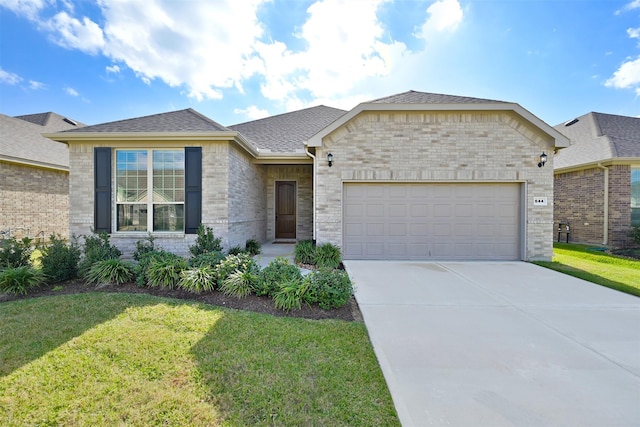 view of front of home featuring a garage and a front yard