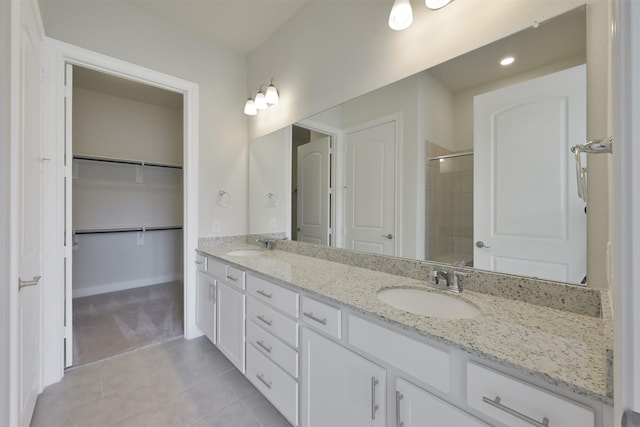 bathroom with vanity and tile patterned flooring