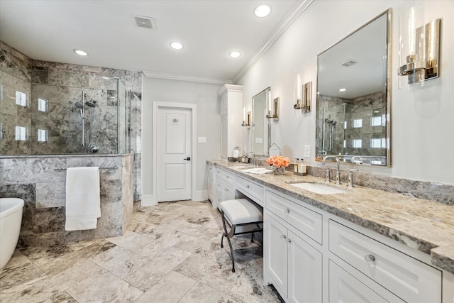 bathroom with vanity, crown molding, and a shower with door