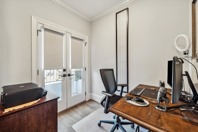 home office featuring french doors, crown molding, and light hardwood / wood-style flooring