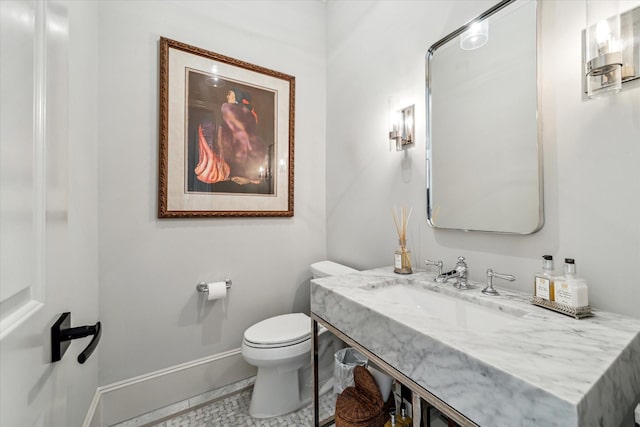 bathroom featuring sink and toilet