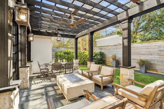 view of patio featuring a pergola, an outdoor hangout area, and ceiling fan