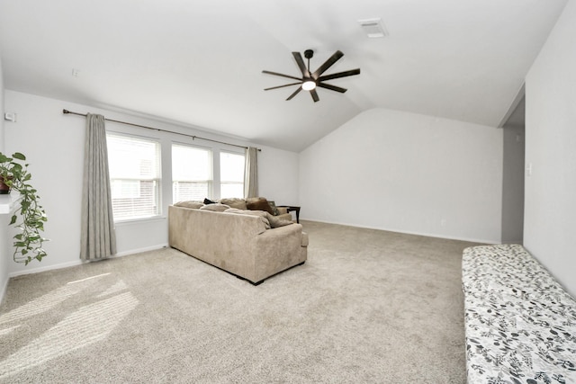 carpeted living room with vaulted ceiling