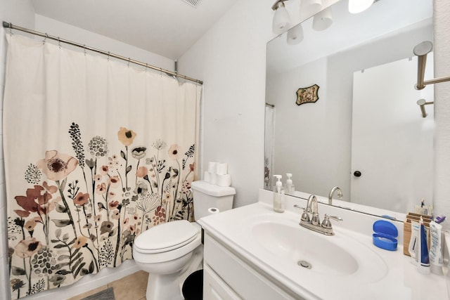 bathroom with vanity, tile patterned flooring, curtained shower, and toilet