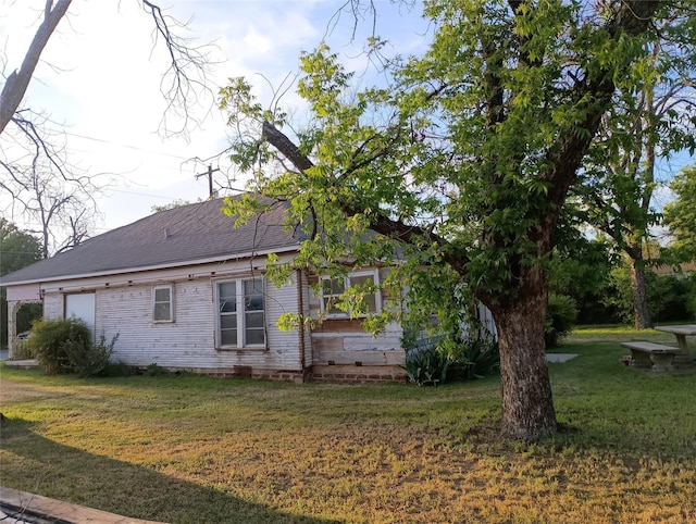 view of home's exterior with a lawn